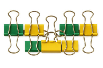 Binder clips arranging in a horizontal line, yellow and green colors alternating, useful stationery for office organization