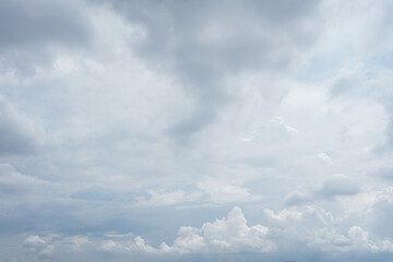 Overcast sky filled with dense layered gray and white cumulus clouds atmospheric texture 97 characters