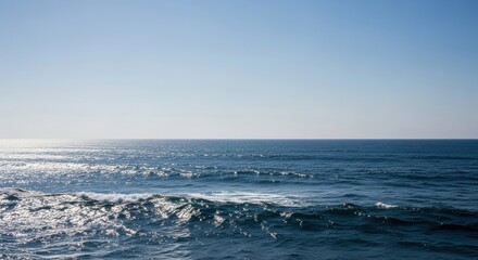 Vast Ocean Expanse Under Clear Blue Sky. Serene Seascape with Choppy Waves and Sunlight Reflections. Tranquil Open Water Scene with Sparkling Highlights.