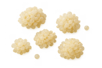 Light golden fish roe pearls transparently floating, delicious seafood delicacy for gourmet cuisine, isolated on checkerboard background