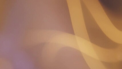 Abstract composition with golden and purple hues soft lines and color blends