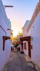 Charming Alleyway in a Traditional Middle Eastern Village at Sunset.