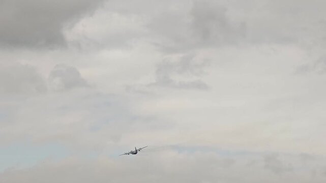 The plane is flying over the sky.