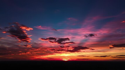 Arabes soaring through the sky at sunset with a bright sun, capturing the dynamic concept of time in motion, perfect for illustrating themes of innovation, progress, or forward thinking ideas.