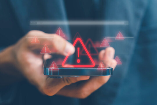 System warning alert on a virtual interface with hand interaction, illustrating cybersecurity risks, data breaches, malware threats, hacking, and digital system vulnerabilities.