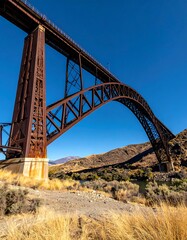 Rusty arch bridge over valley