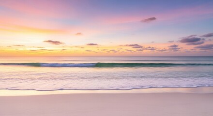 Serene beach at sunrise with pastel colored sky and gentle waves lapping the shore