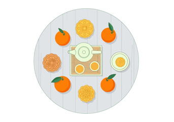 Citrus fruits and tea set arranged on a wooden table.