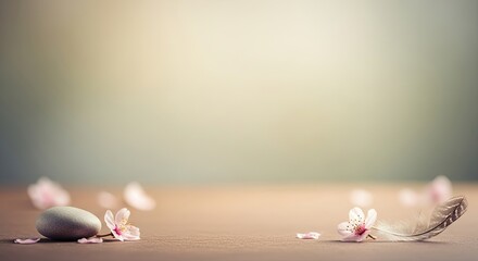 A wooden table with a white stone and cherry blossom petals.