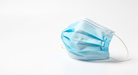 A blue surgical mask on a white background.