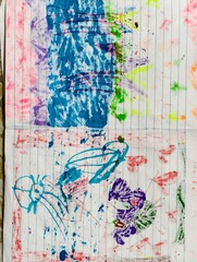 An abstract, colorful child's artwork features vibrant blue, pink, purple, and neon scribbles on lined notebook paper.