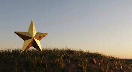 Golden star on grassy hill at sunset — symbol of success and excellence, award concept, copy space available