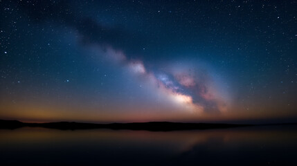 Fototapeta premium Milky Way Galaxy Mirrored in a Calm Lake Beneath a Starry Night Sky