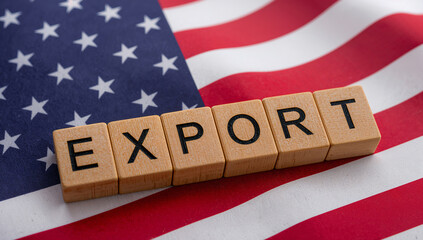 Wooden EXPORT cubes on US flag illustrating American export economy, global distribution, and trade logistics.