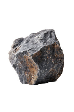 Rough grey rock with brown streaks on a stark black background