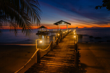 Fototapeta premium Breathtaking sunset view from a pier on Koh Kood Island, Thailand