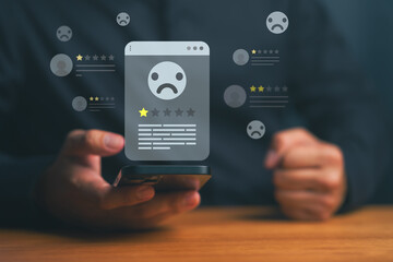 Negative review concept, person holding a smartphone with low-star ratings and sad-face icons, customer dissatisfaction, poor service feedback, online reputation issues, and brand trust decline.