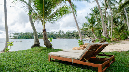 Relaxing beachside lounge chairs with tropical views on Koh Kood Island