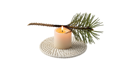 A lit candle with a pine branch on a woven coaster isolated on transparent background