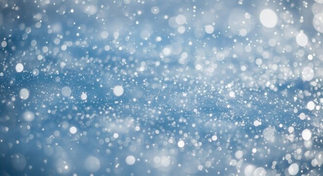 Abstract background of falling snow or snowflakes with bokeh effect, winter season