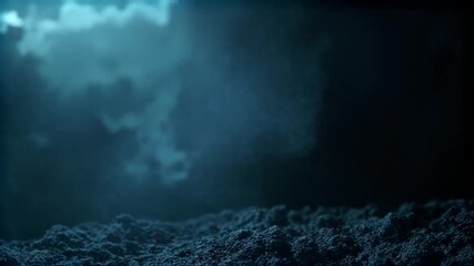 Dark Stormy Clouds Gathering Over a Textured Landscape at Night