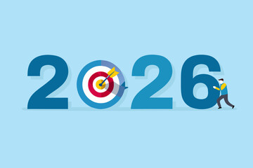 Man pushing the number 6 of 2026 with a target and arrow in the center representing goals and success