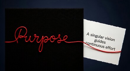 Red Text Writing Purpose on Black Card With Text Peeking Out
