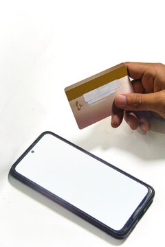 hand holding a credit card on white background