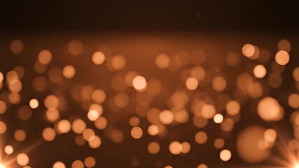 Softly glowing amber and bronze bokeh lights create a warm, festive atmosphere, perfect for celebrations and special occasions with a magical shimmer