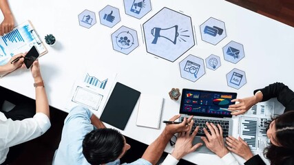 A diverse business team collaborates on digital marketing strategies, analyzing data on laptops surrounded by various communication icons and performance charts. Raster - Powered by Adobe