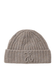 Warm knitted winter cap on a plain white backdrop for woman