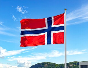 A vibrant national flag, featuring a red field with a blue Nordic cross outlined in white, floats against a bright blue sky with wispy clouds
