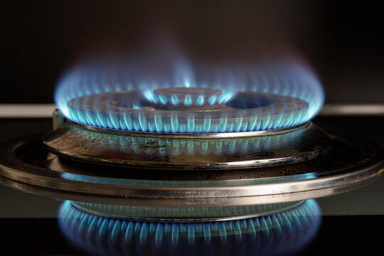 Gas stove is turned on. Closeup view of burning flame
