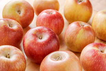 Closeup view of juicy apples on a wooden table