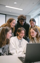 Fototapeta premium Group of students collaborating on a laptop in a classroom