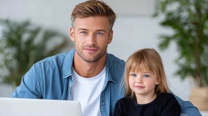 Father and daughter with blue eyes smiling at home