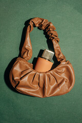 Green vintage bag and perfume jar minimalist