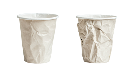 Disposable crumpled paper cups showing textured crushed surfaces and lightweight waste materials suitable for recycling purposes isolated on white background