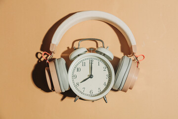 Alarm clock with headphones music concept