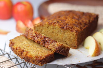Apple cinnamon bread. Freshly baked loaf with slices cut, showing moist interior and golden crust