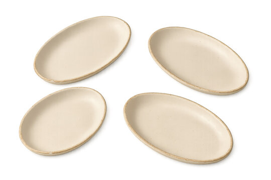 Oval ceramic plates set for dining or serving food, showcasing modern beige kitchenware on transparent background