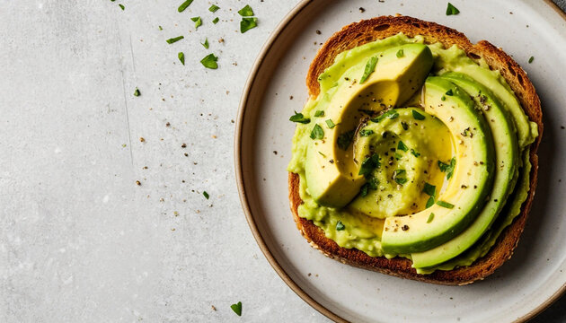 Avocado toast showcases creamy green slices atop golden whole-grain bread, garnished with fresh herbs and black pepper for a vibrant, fresh appeal. Rustic flat lay on a white plate against 