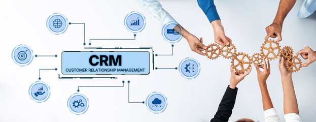 Visual representation of CRM with collaborative hands holding gears and technology icons. Ideal for illustrating customer engagement and business strategy. Trope