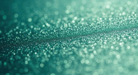 A green and blue abstract background with a bokeh effect.