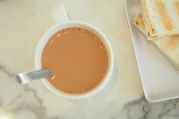 Delicious chai and toast enjoy breakfast in cozy cafe
