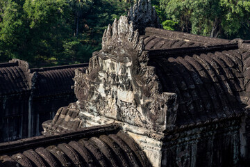 Angkor wat ornate pediment with naga carvings crowning a tiled gallery roof in siem reap, cambodia © night87
