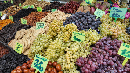 Colorful fruit and nut display at local market in autumn