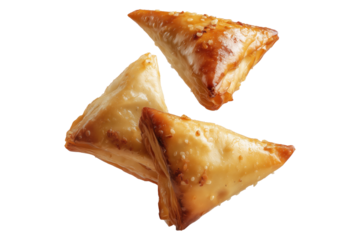 Briouat triangular fruit filled pastries, phyllo pastries filled with meat or almonds isolated on white transparent background, concept of Arabic sweet baked desserts