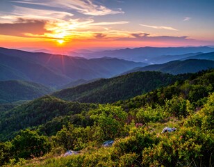 Panoramic view of mountain ranges during a vibrant sunrise