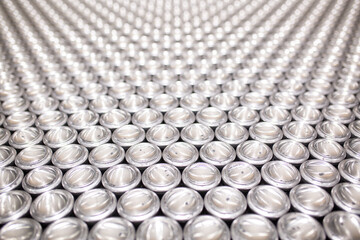 Close-up of aluminum cans on a conveyor belt. Plant for the production of energy drinks. Conveyor...